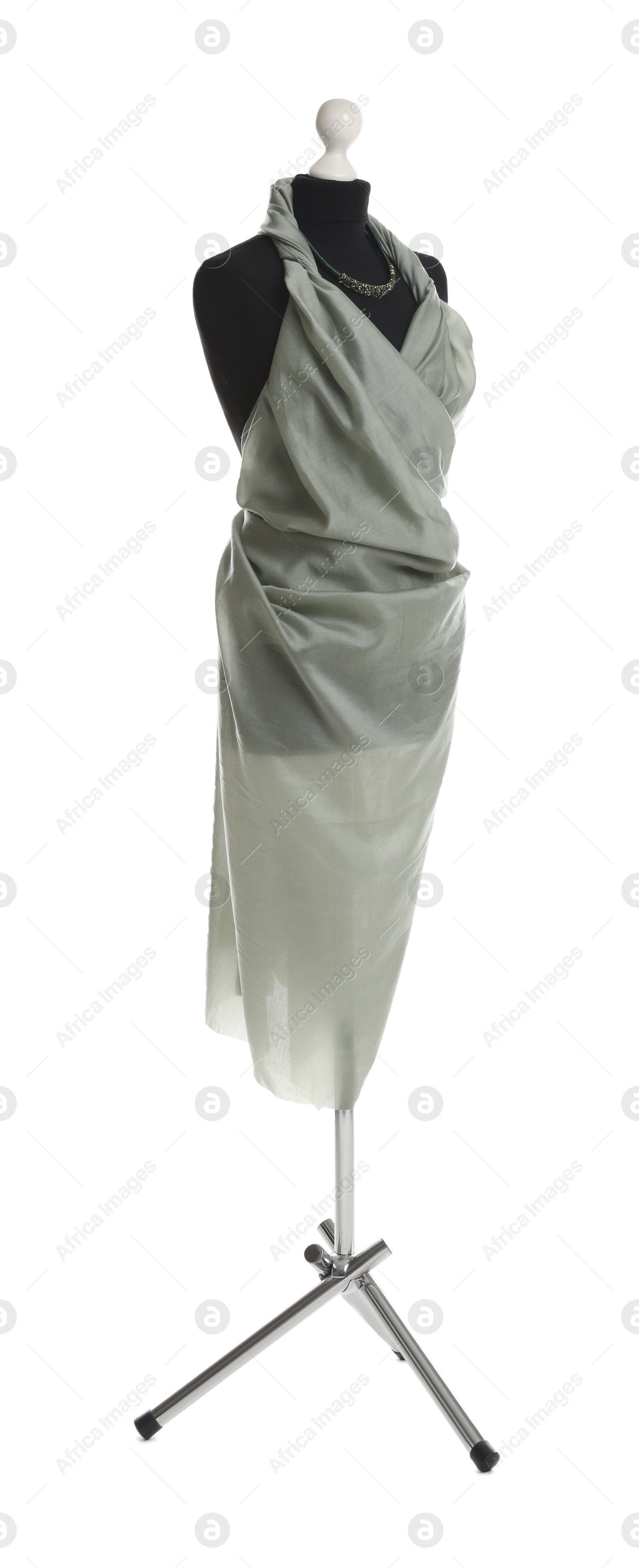 Photo of Draping grey fabric on female mannequin against white background