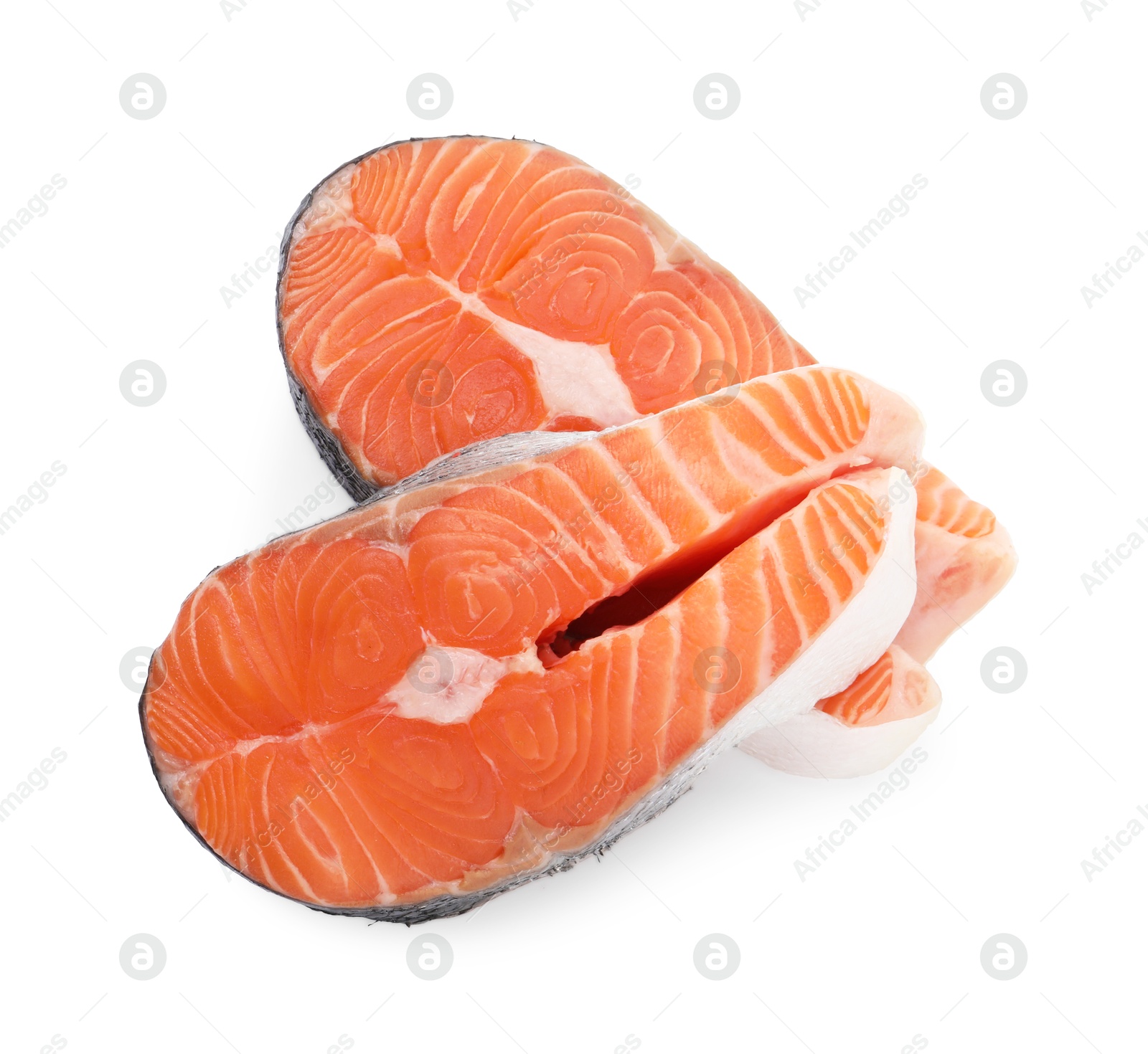 Photo of Steaks of fresh raw salmon isolated on white, top view