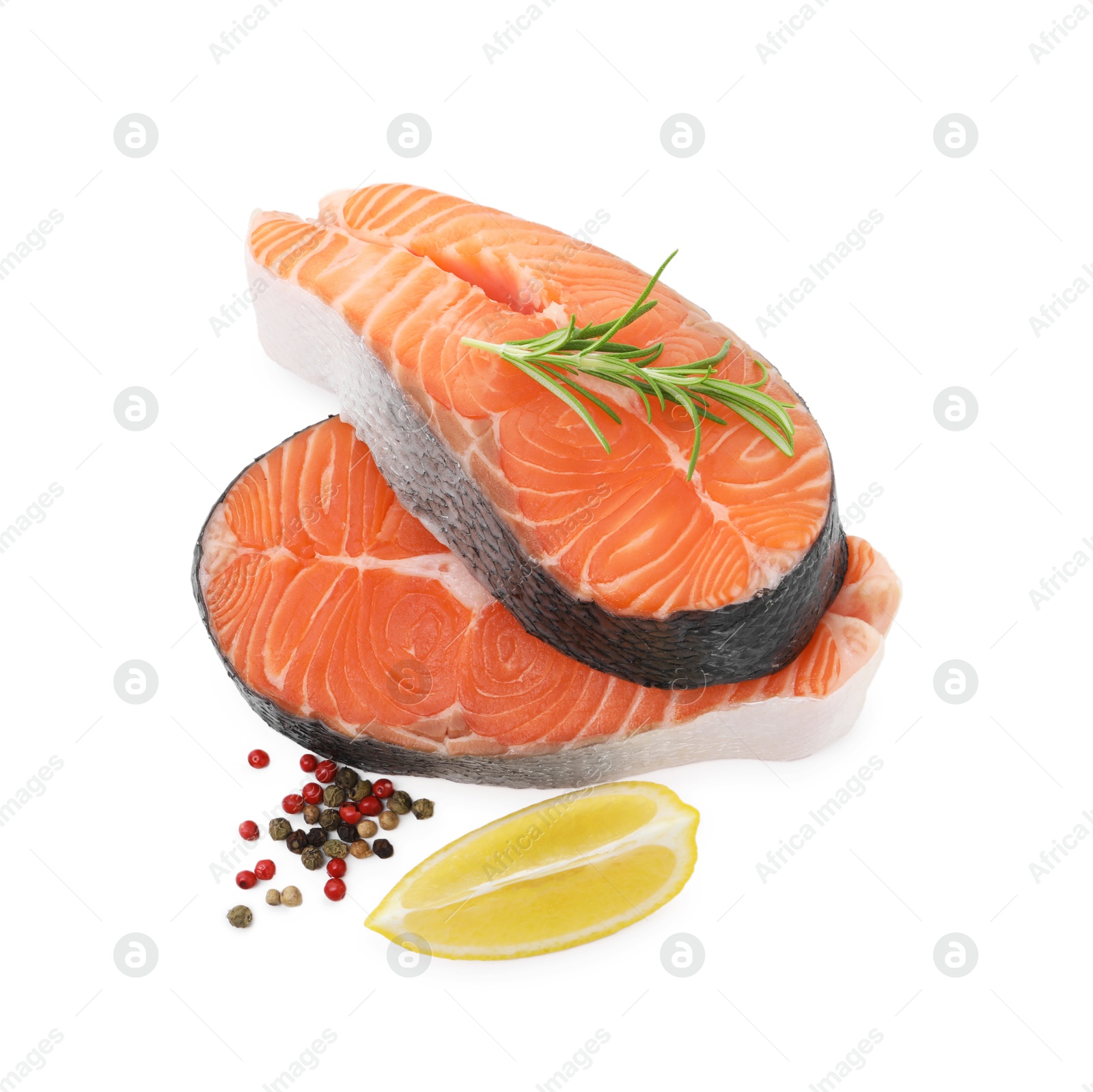 Photo of Steaks of fresh raw salmon and spices isolated on white