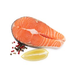 Photo of Steak of fresh raw salmon and spices isolated on white, top view