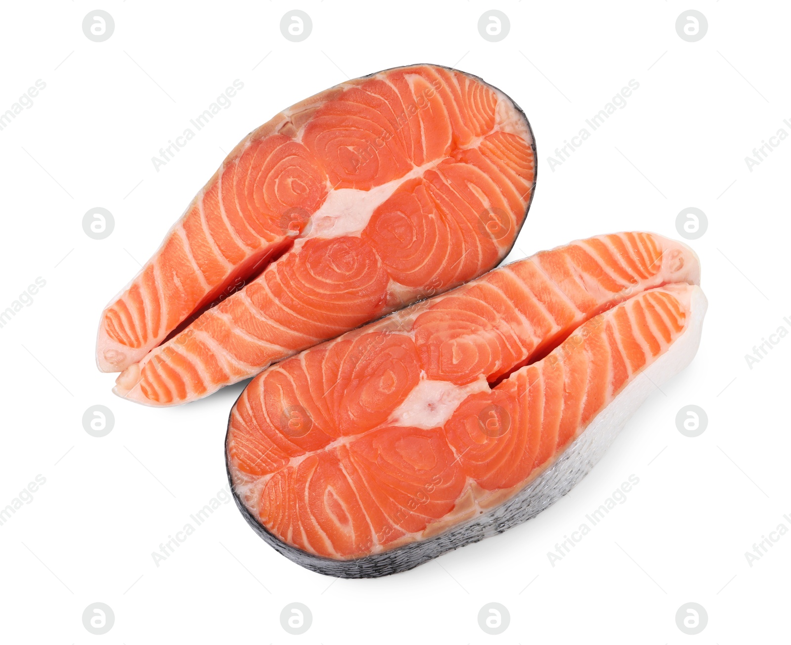 Photo of Steaks of fresh raw salmon isolated on white, top view