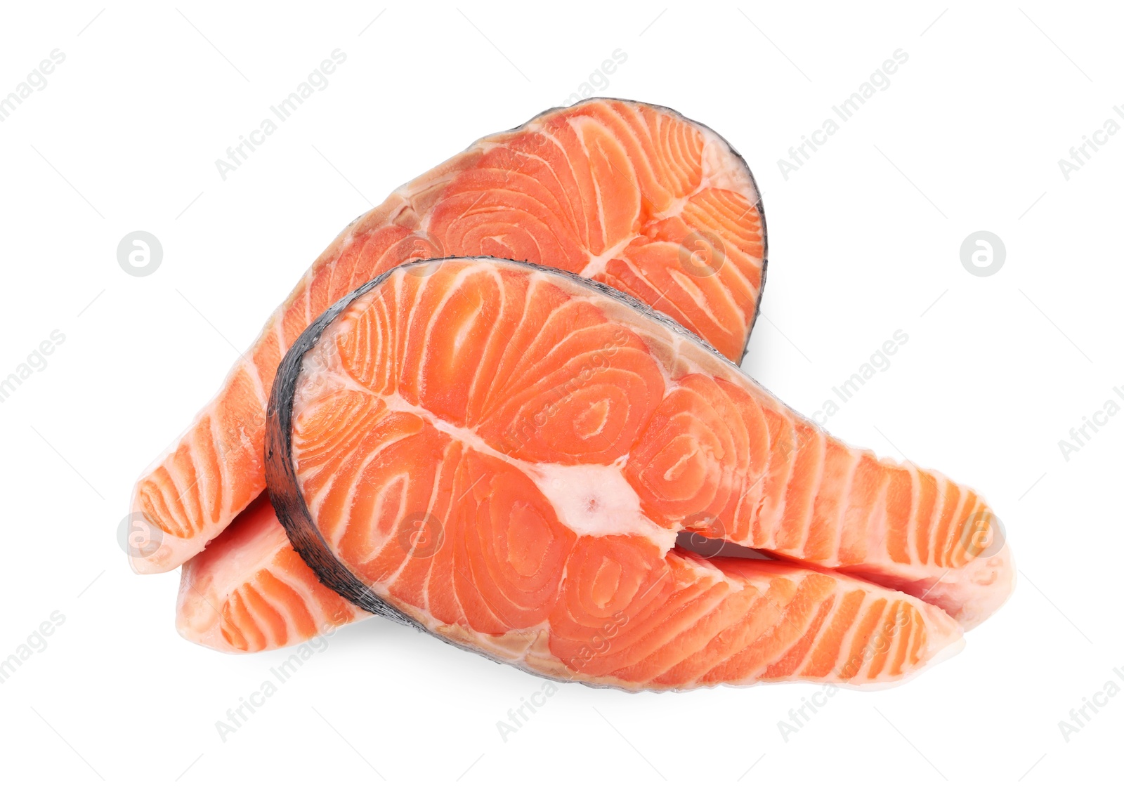 Photo of Steaks of fresh raw salmon isolated on white, top view