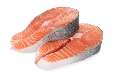 Photo of Steaks of fresh raw salmon isolated on white