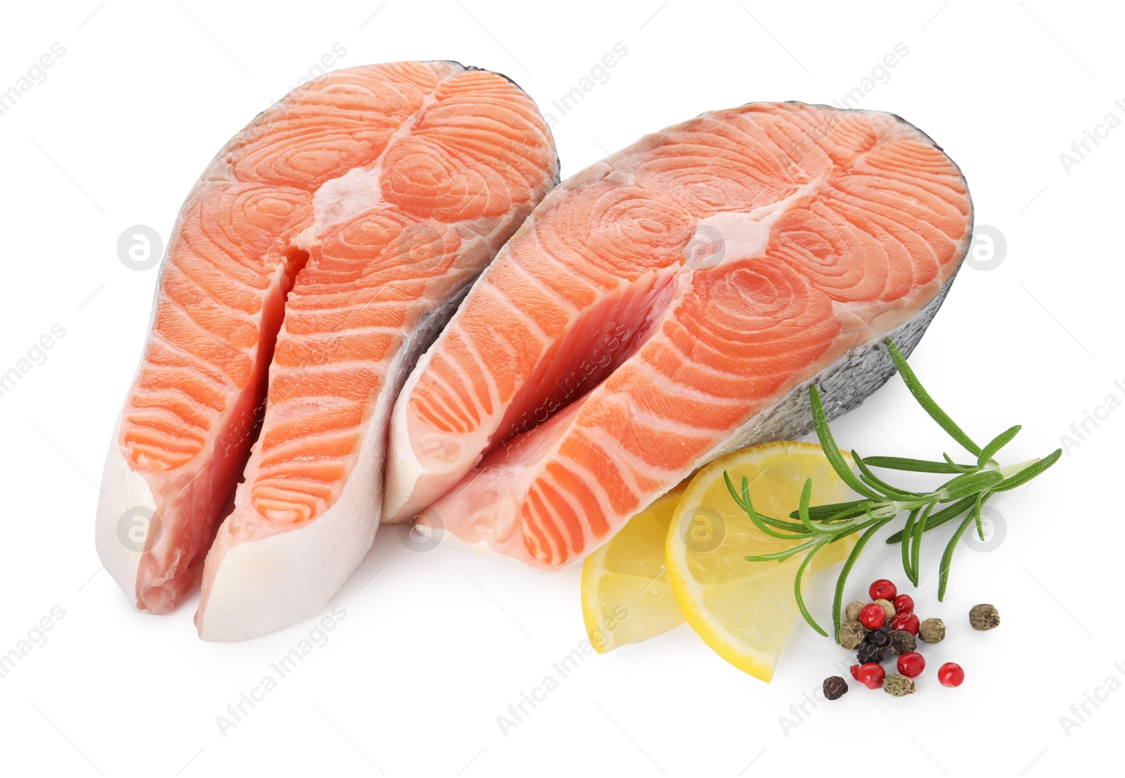 Photo of Steaks of fresh raw salmon and spices isolated on white