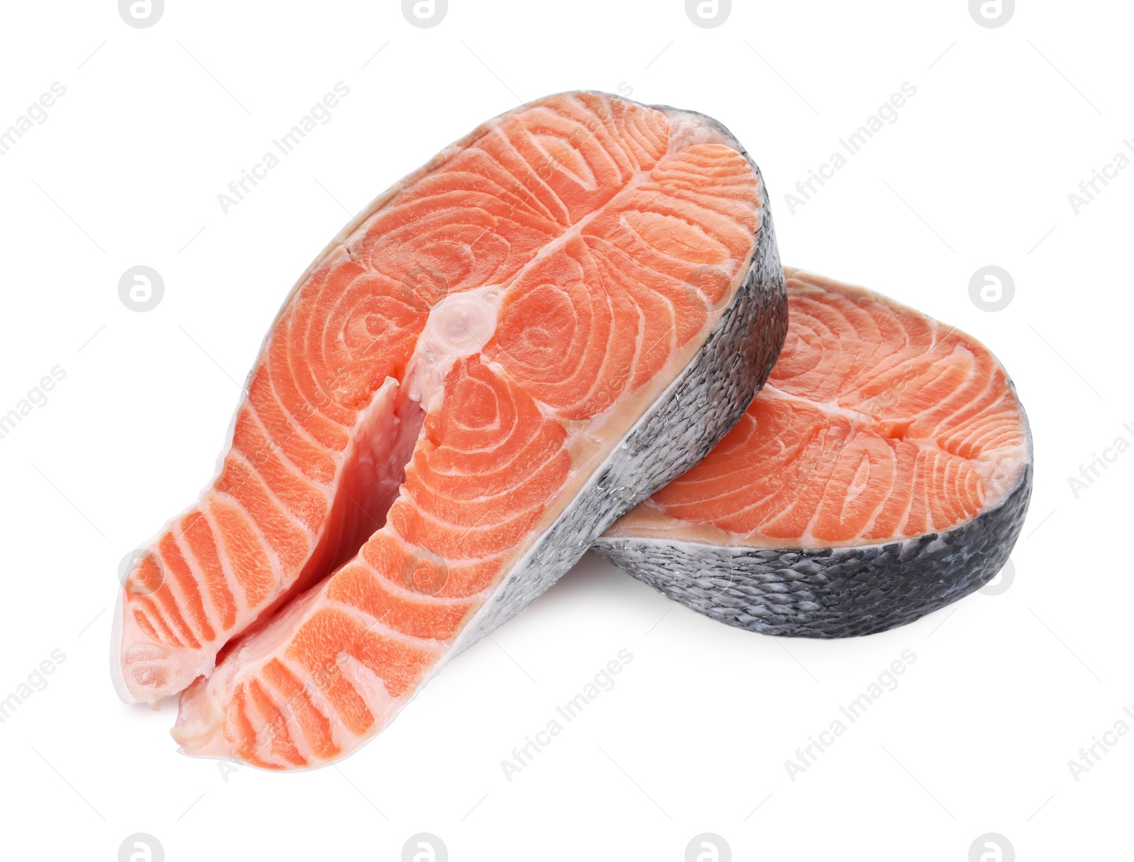 Photo of Steaks of fresh raw salmon isolated on white