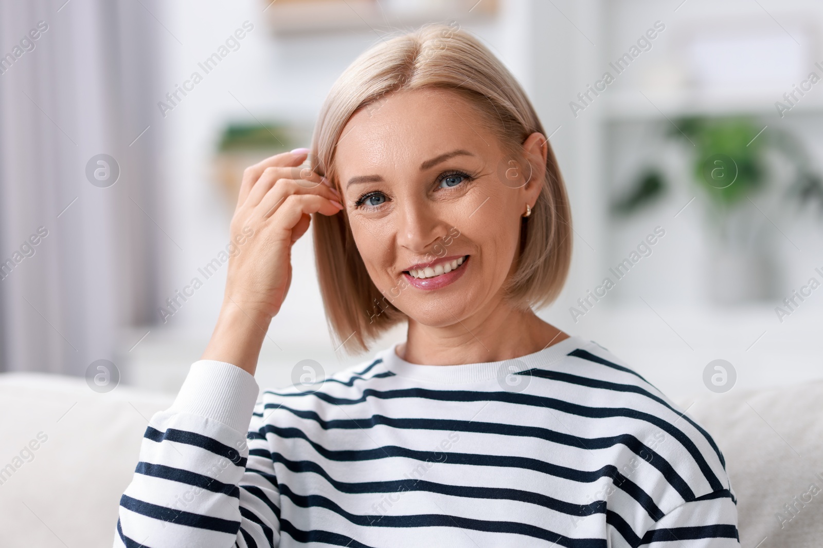 Photo of Portrait of happy middle aged woman indoors