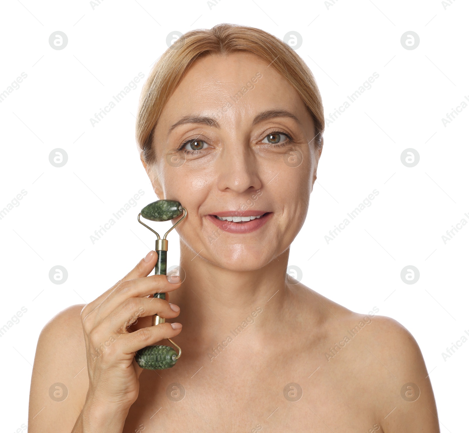 Photo of Smiling woman doing facial self massage with roller on white background