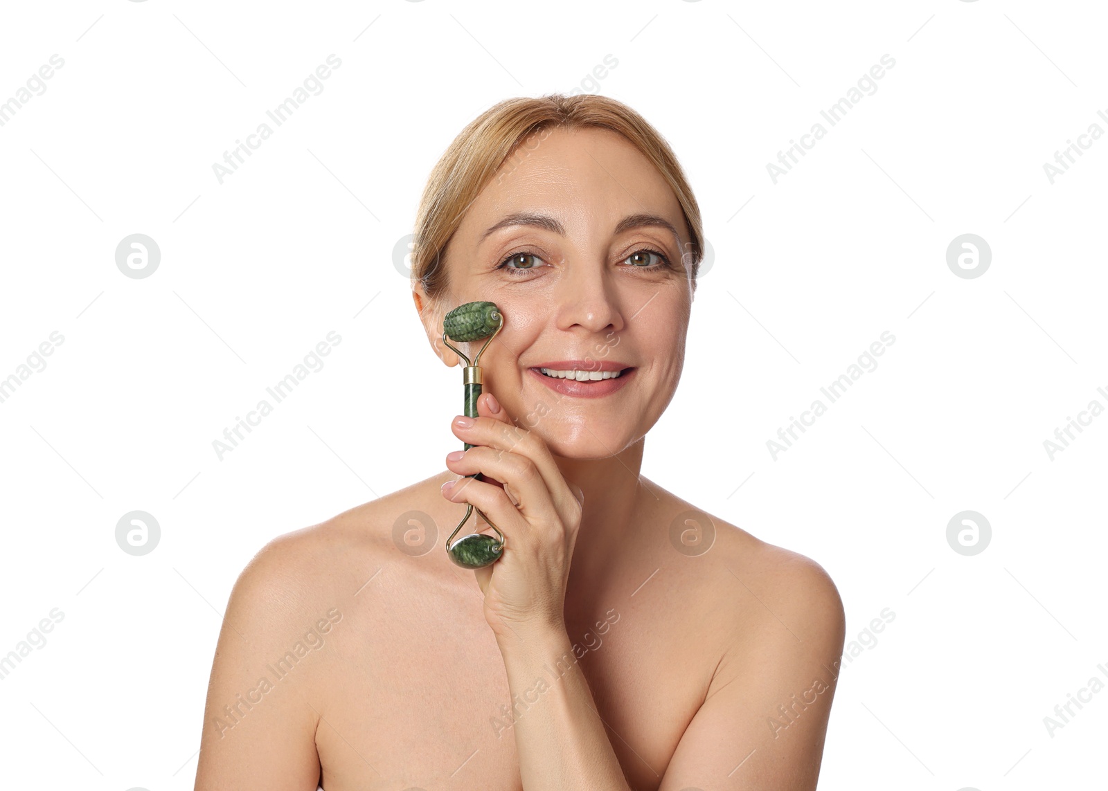 Photo of Smiling woman doing facial self massage with roller on white background