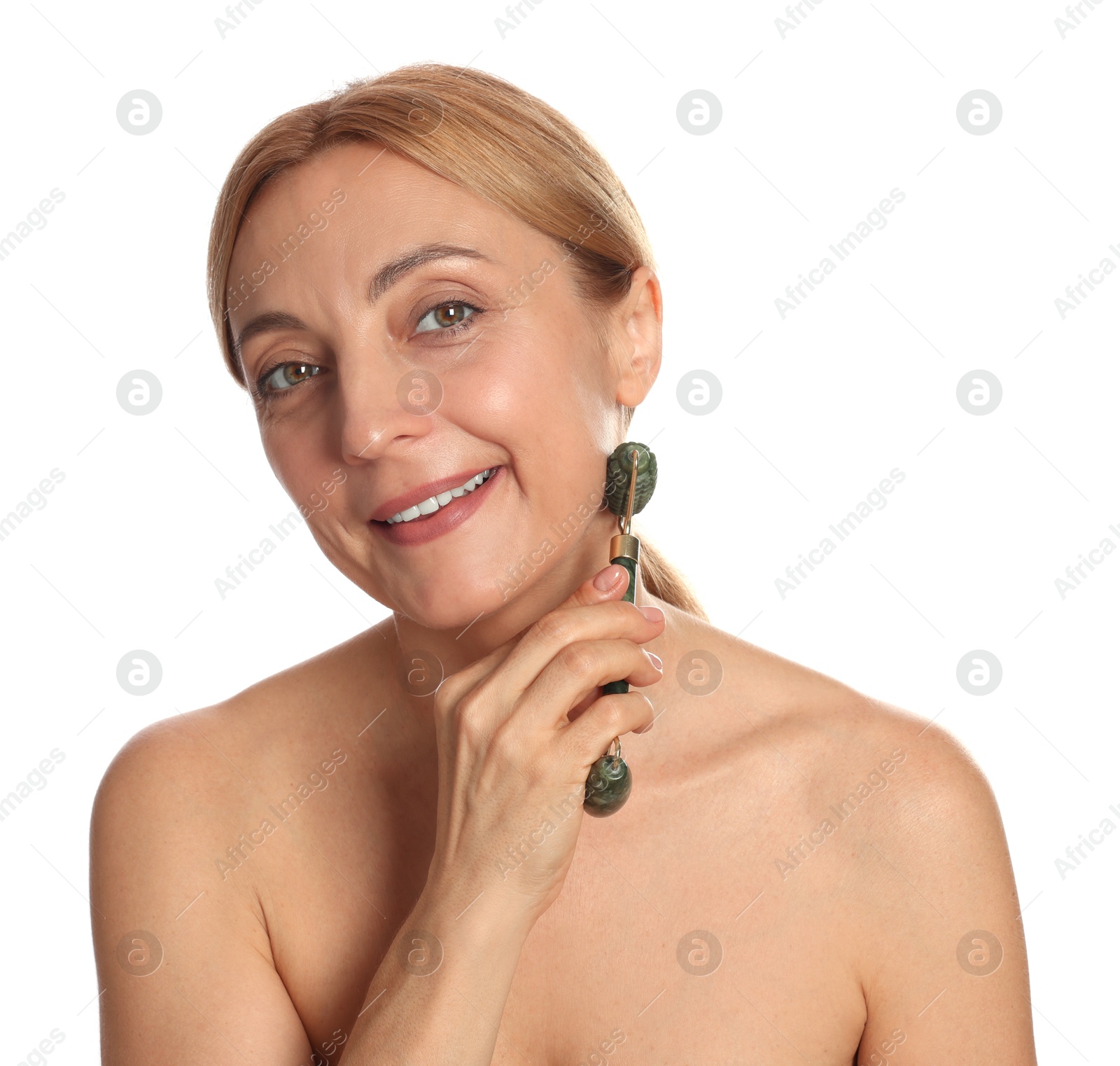 Photo of Smiling woman doing facial self massage with roller on white background