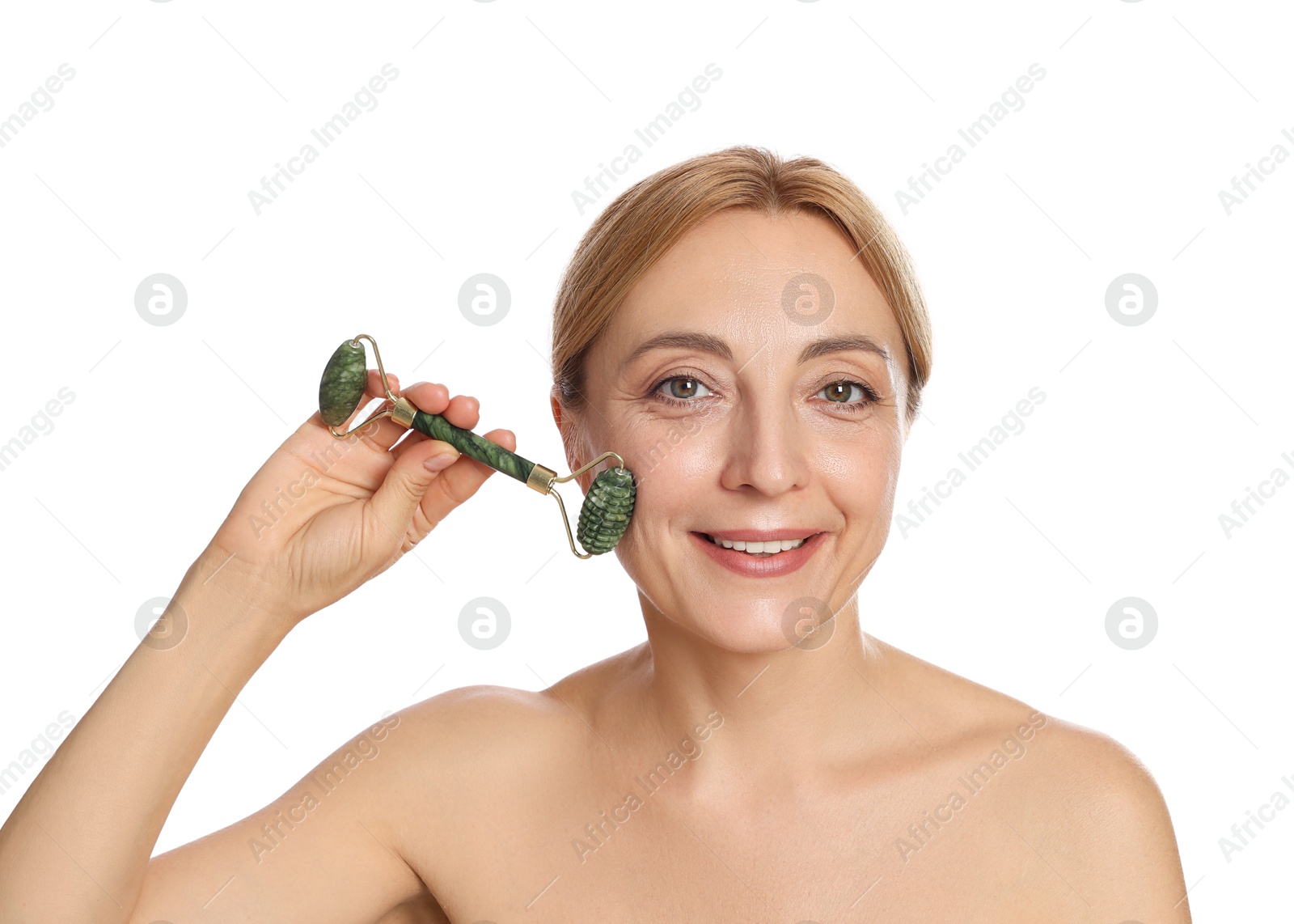 Photo of Smiling woman doing facial self massage with roller on white background