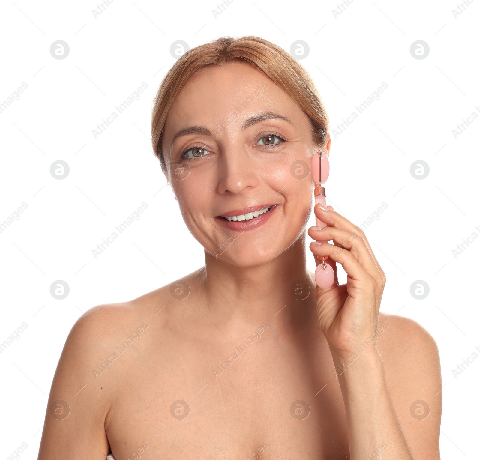 Photo of Smiling woman doing facial self massage with roller on white background