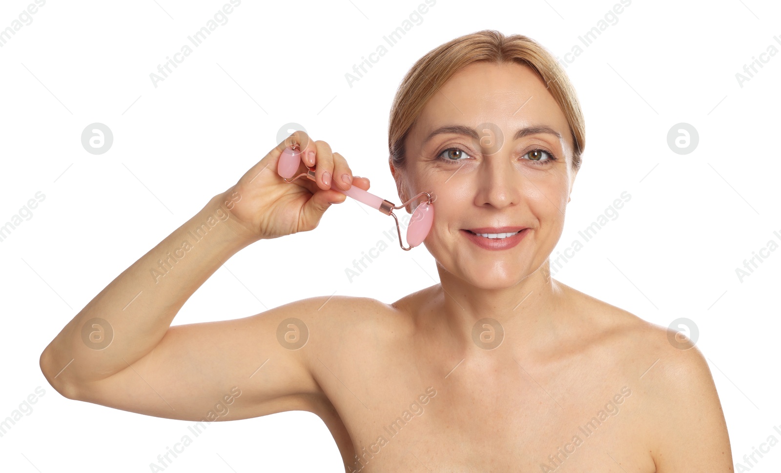 Photo of Smiling woman doing facial self massage with roller on white background