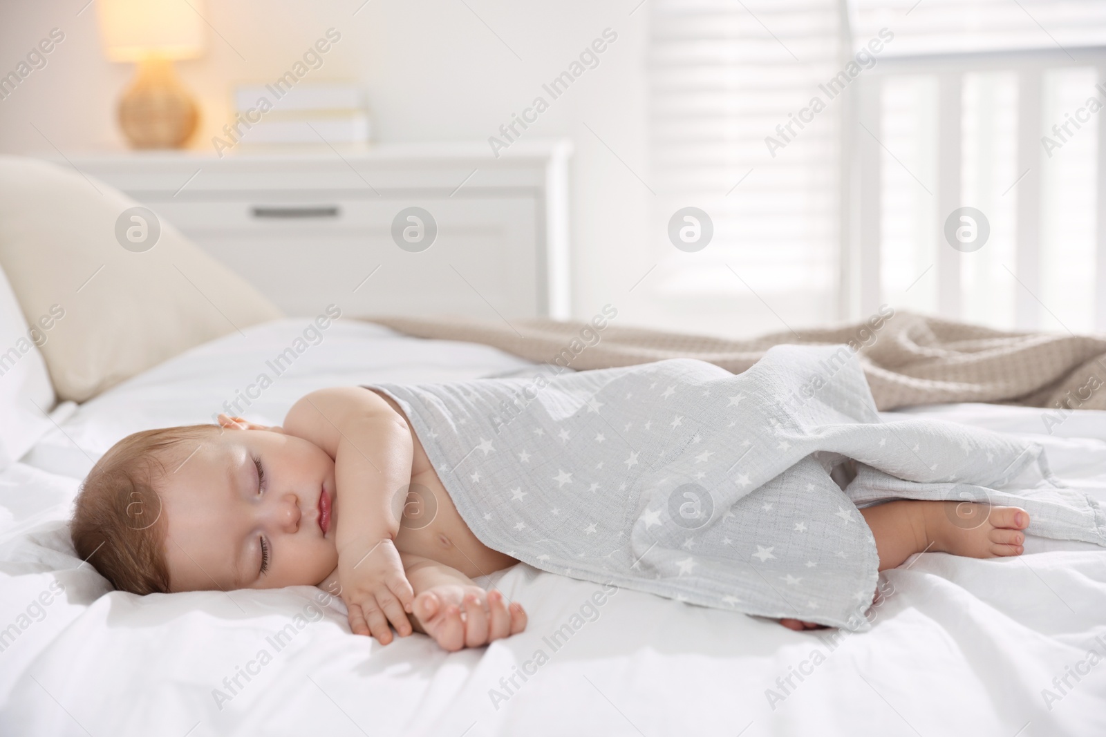 Photo of Cute little baby sleeping on bed at home