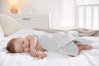 Cute little baby sleeping on bed at home