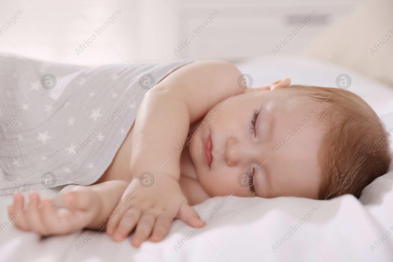 Photo of Cute little baby sleeping on bed at home