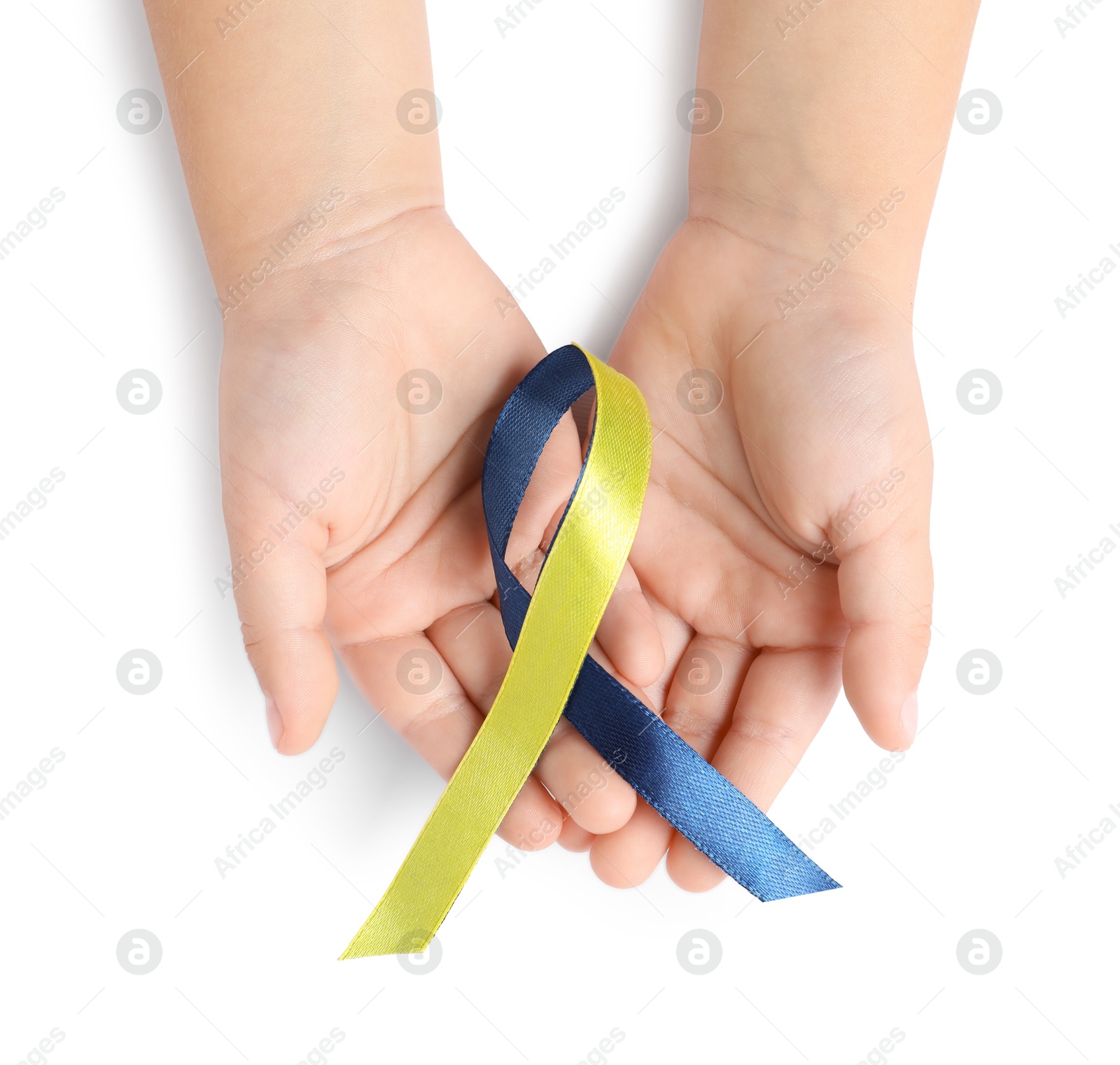 Photo of Child with yellow and blue ribbon on white background, top view. Down syndrome awareness