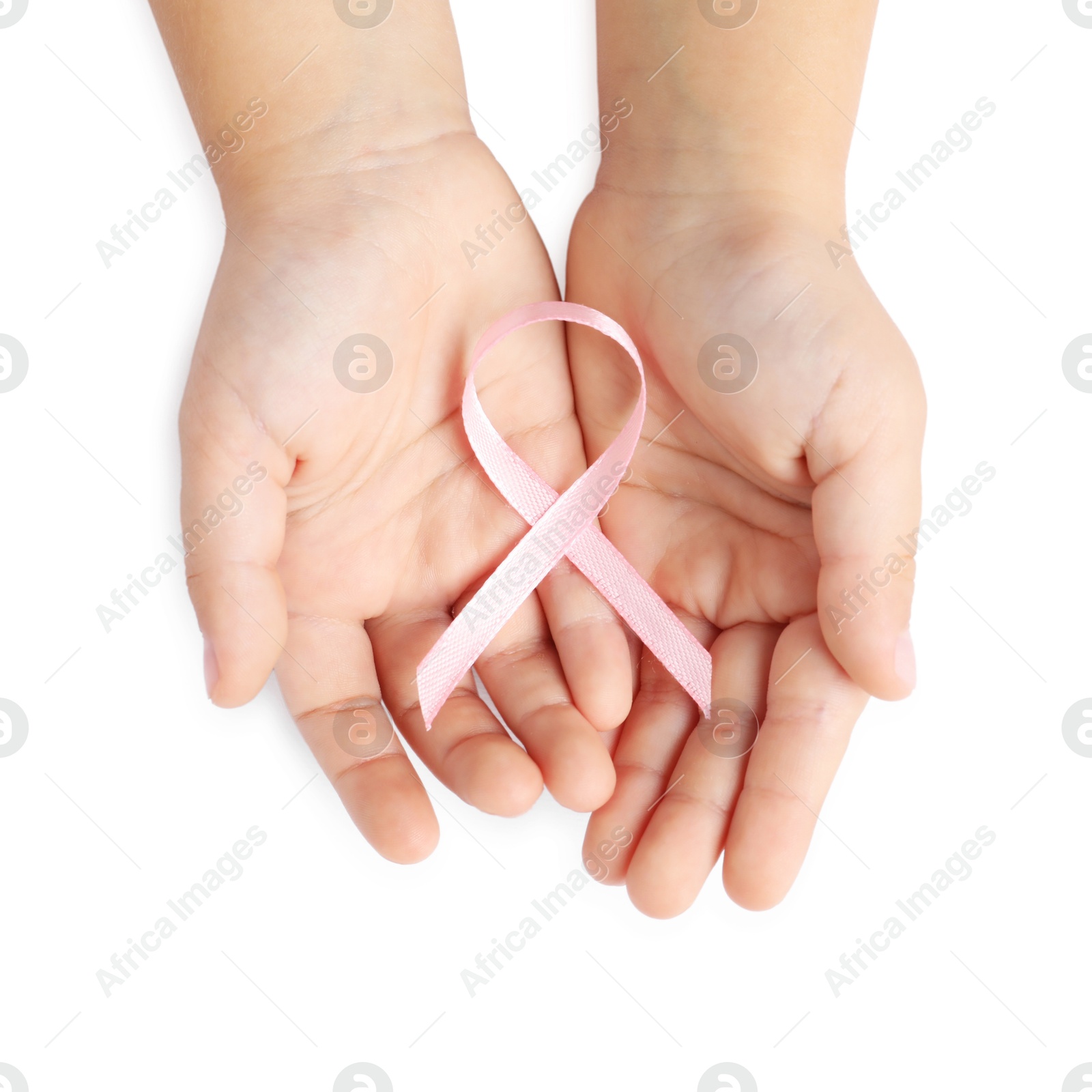 Photo of Child with pink ribbon on white background, top view. Breast cancer awareness