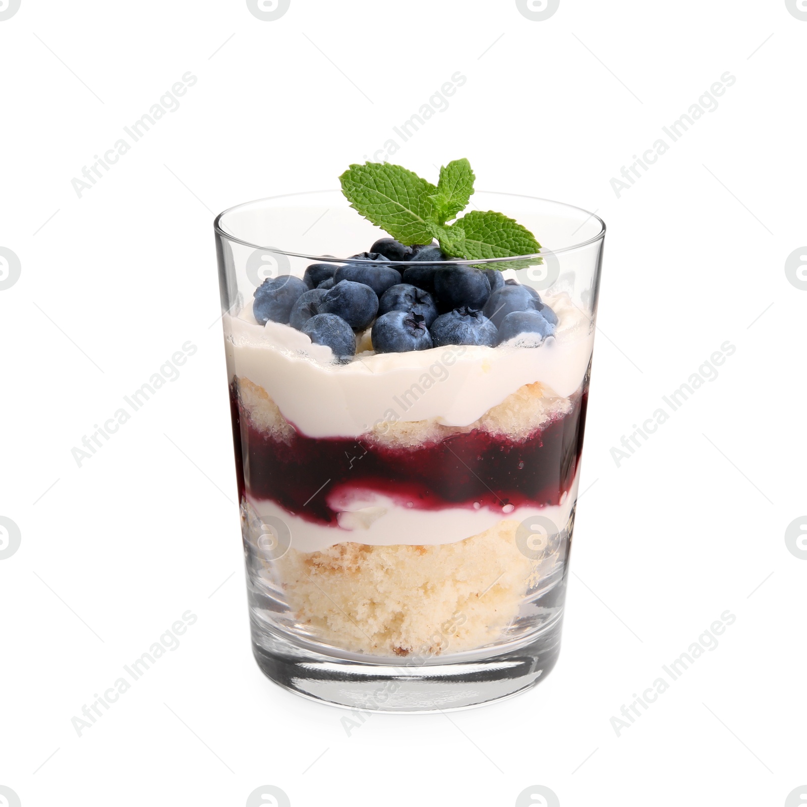 Photo of Tasty trifle dessert. Sponge cake, blueberries, jam and whipped cream in glass isolated on white