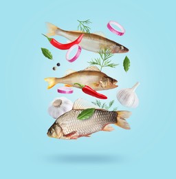 Image of Different sea food in air on light blue background