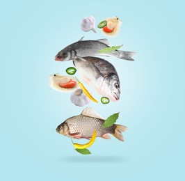 Image of Different sea food in air on light blue background