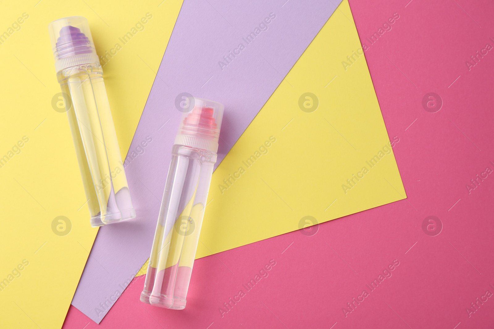 Photo of Glue and colorful paper on pink background, top view. Space for text