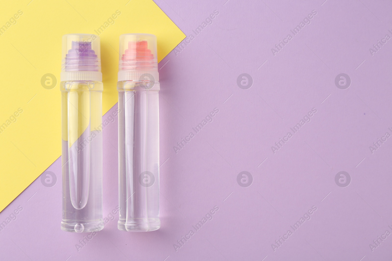 Photo of Transparent glue on color background, flat lay. Space for text