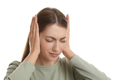 Photo of Woman covering her ears on white background