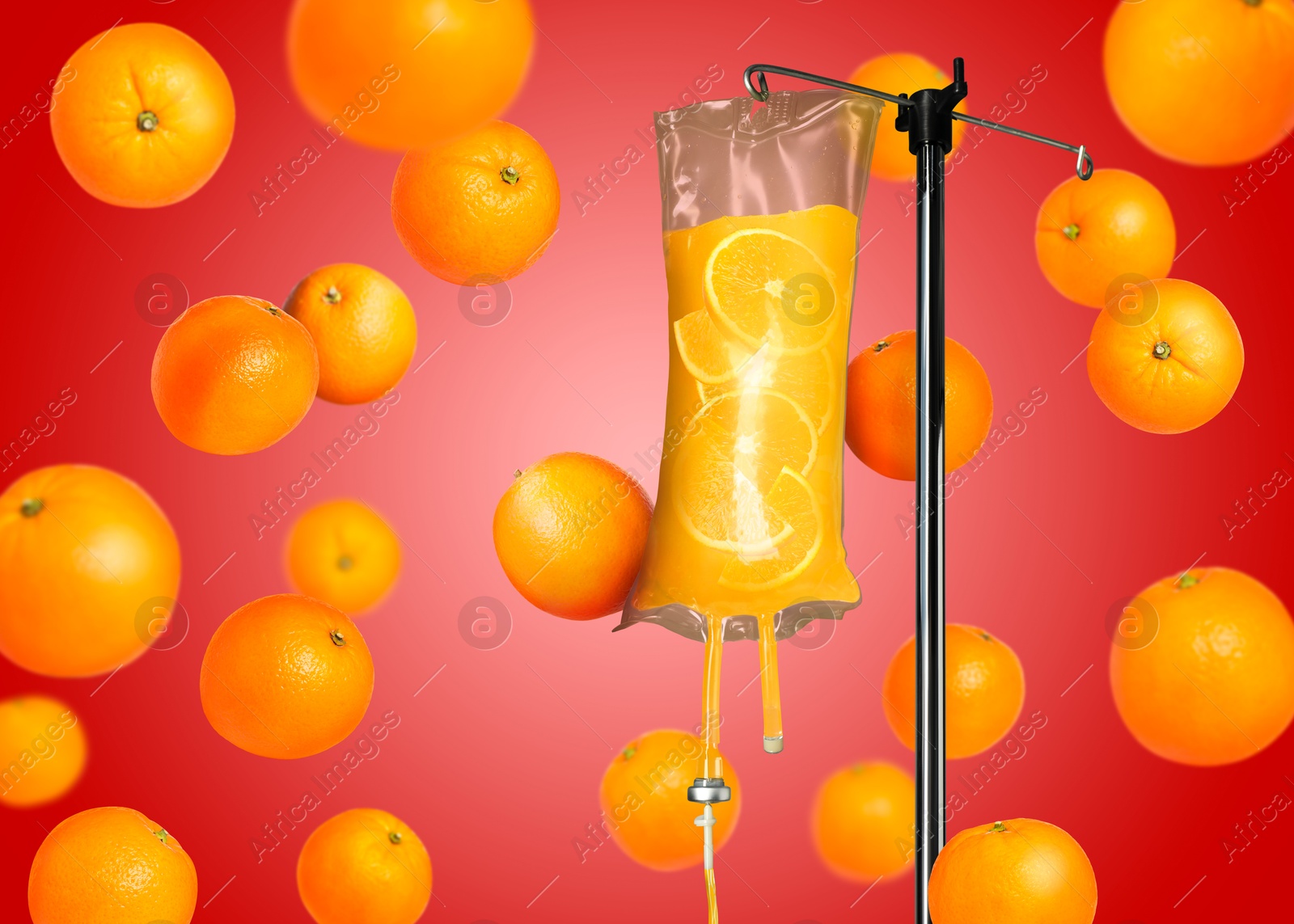 Image of Vitamin intravenous therapy. IV infusion set and falling oranges on red background