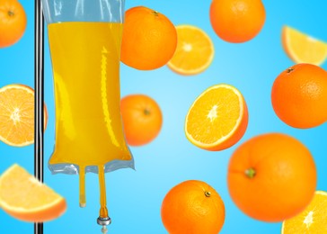 Image of Vitamin intravenous therapy. IV infusion set and falling oranges on light blue background