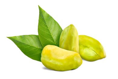 Shelled pistachios and green leaves on white background. Tasty nut