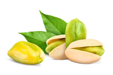 Image of Pistachios and green leaves on white background. Tasty nut