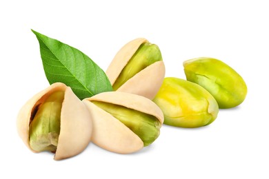 Image of Pistachios and green leaf on white background. Tasty nut