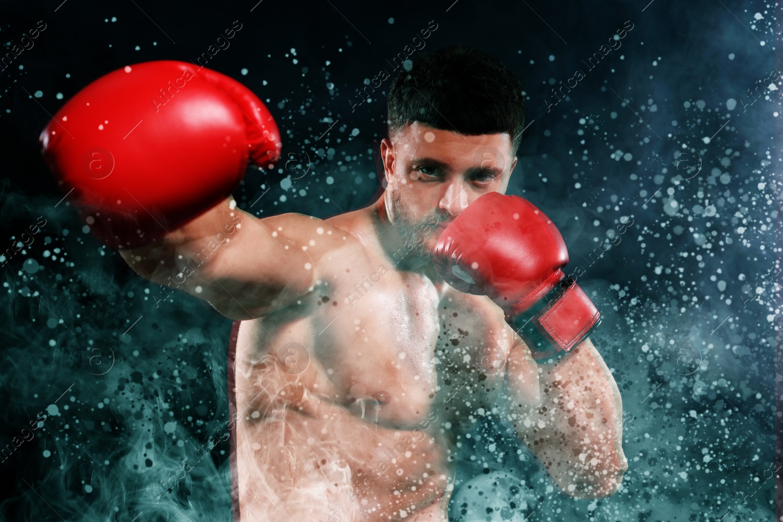 Image of Boxer training in smoke on black background