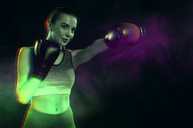 Boxer fighting in smoke on black background, glitch effect