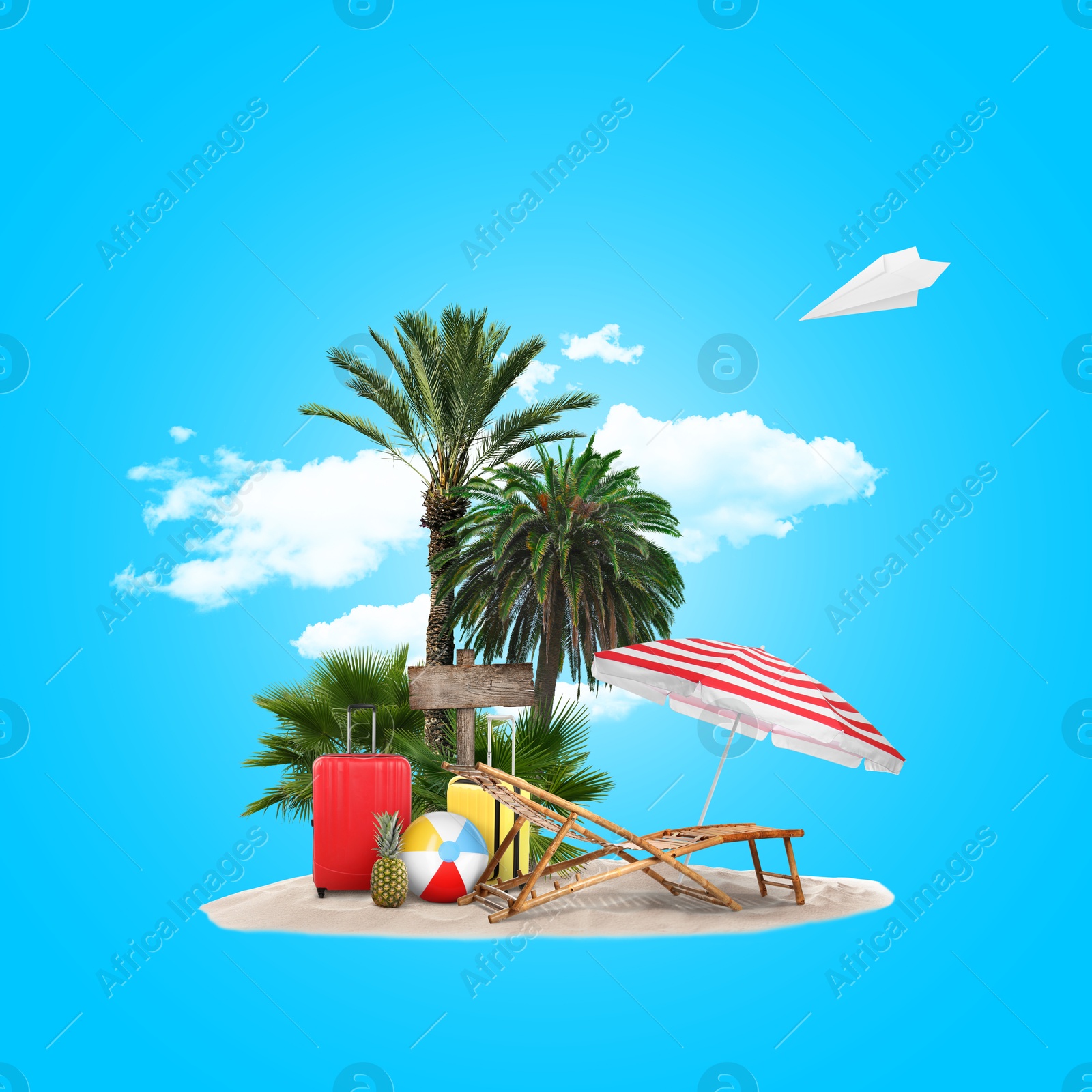 Image of Summer travel. Pile of sand with palms, suitcases, wooden direction sign, beach ball, sunlounger and umbrella under clouds on light blue background. Paper plane flying over island