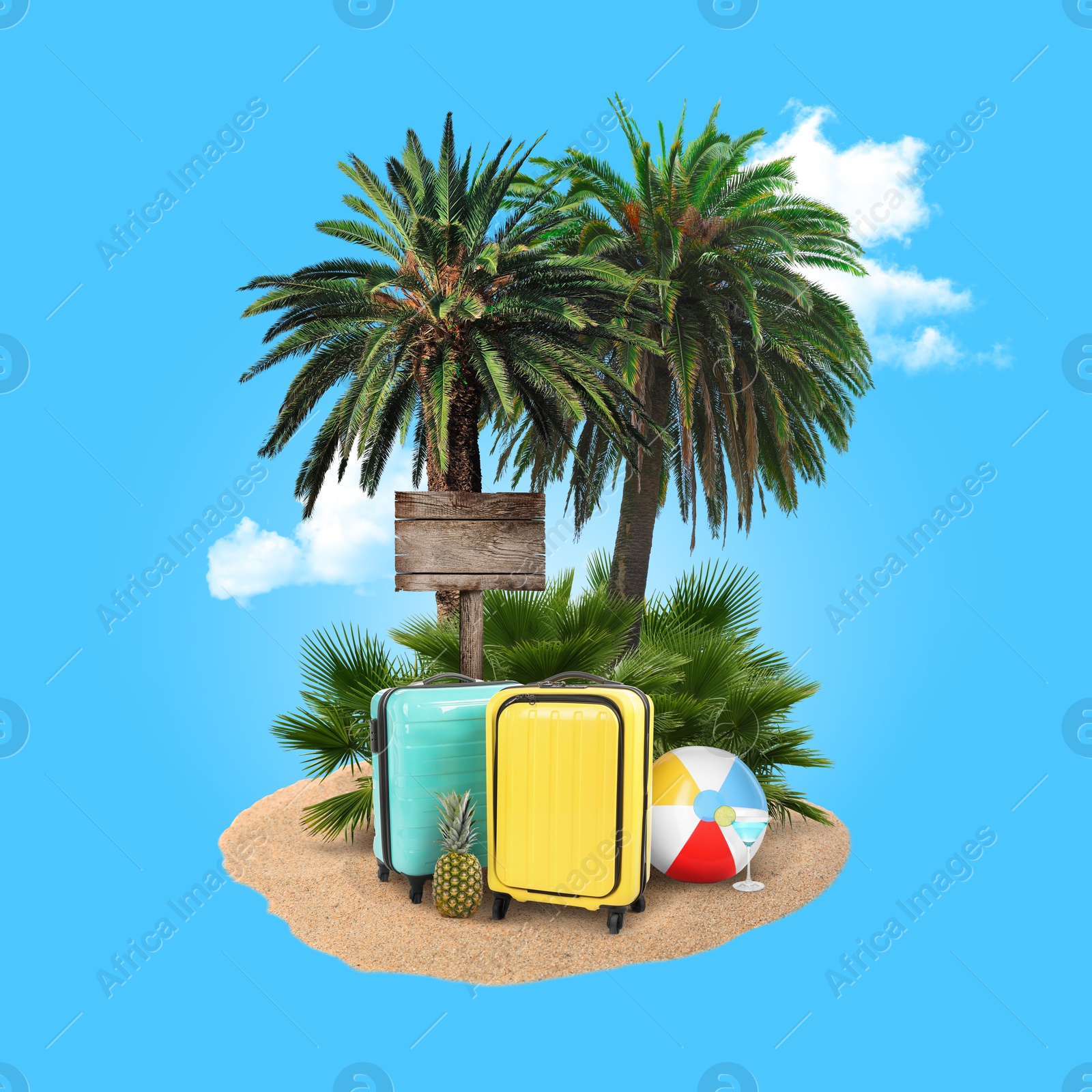 Image of Summer travel. Pile of sand with palms, suitcases, wooden direction sign and beach ball under clouds on light blue background