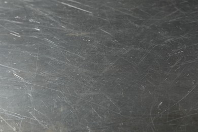 Photo of Texture of scratched metallic surface as background, closeup