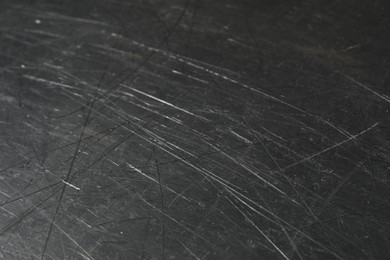 Photo of Texture of scratched metallic surface as background, closeup