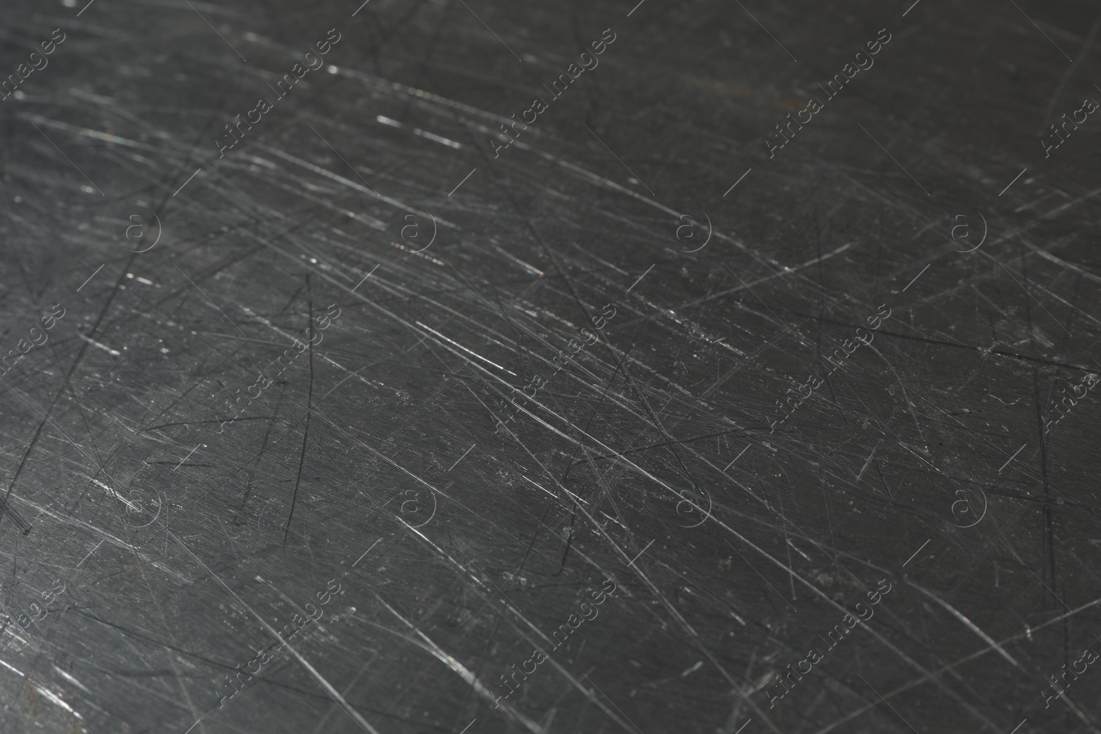 Photo of Texture of scratched metallic surface as background, closeup