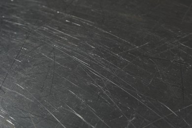 Photo of Texture of scratched metallic surface as background, closeup