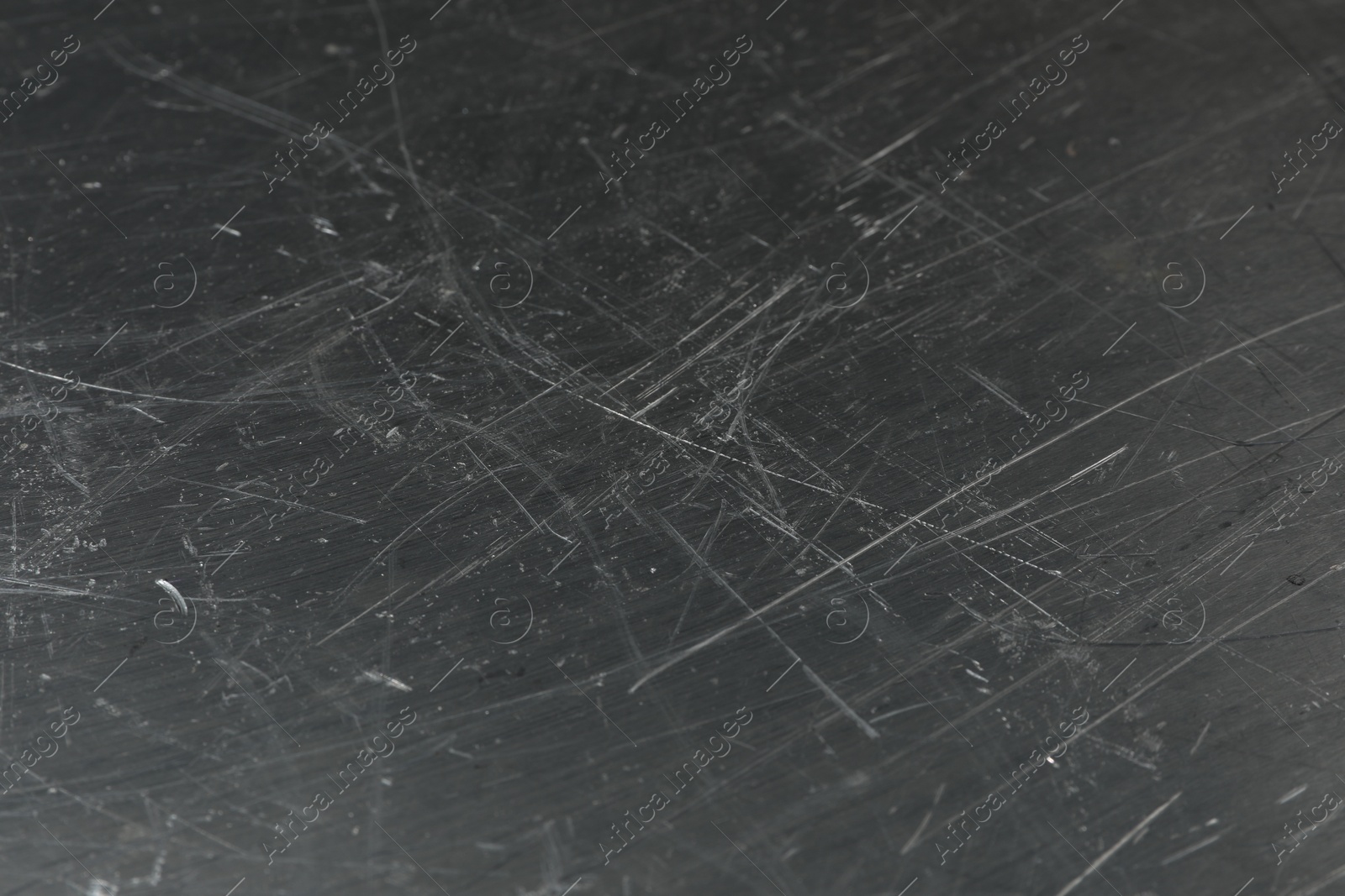 Photo of Texture of scratched metallic surface as background, closeup