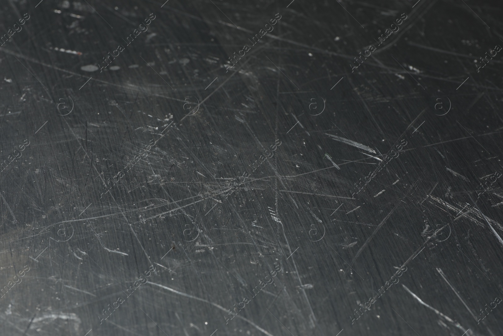 Photo of Texture of scratched metallic surface as background, closeup