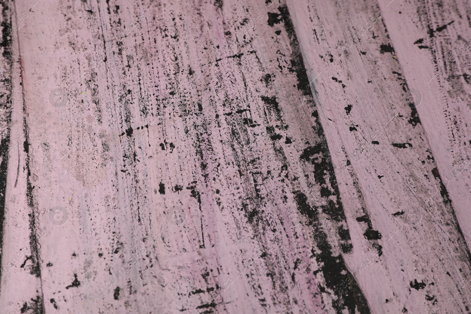 Photo of Old pink wooden surface with scratches as background, closeup