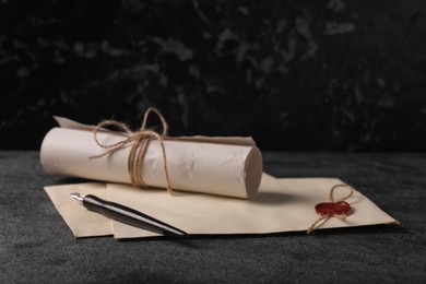 Photo of Old letters and fountain pen on grey table