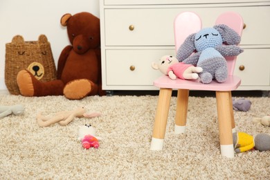 Photo of Different toys and chair in kid's room