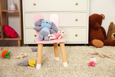 Photo of Different toys and chair in kid's room