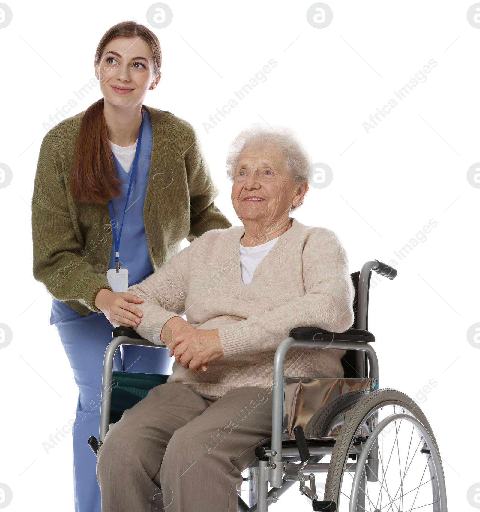 Photo of Caregiver assisting senior woman in wheelchair on white background. Home health care service