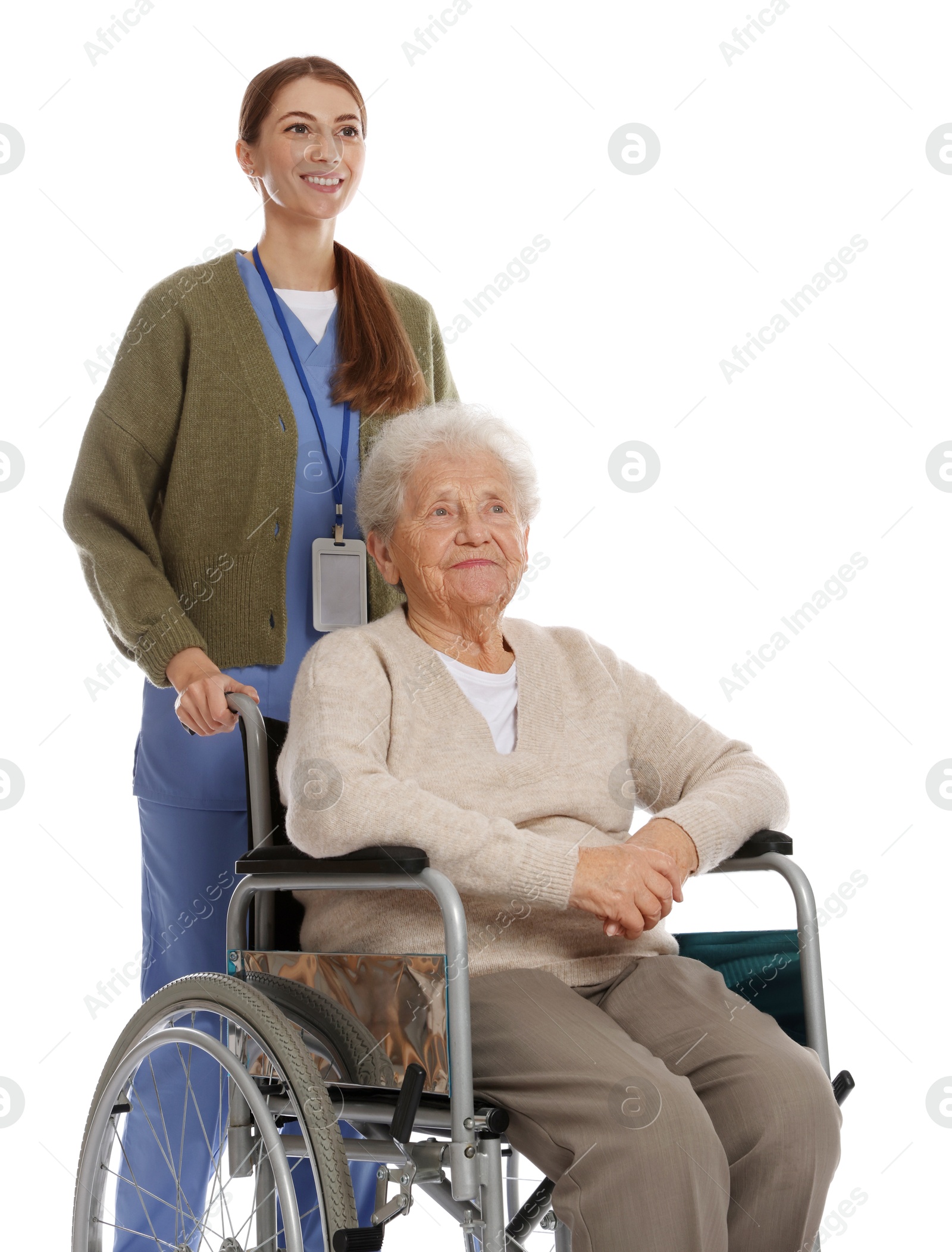 Photo of Caregiver assisting senior woman in wheelchair on white background. Home health care service