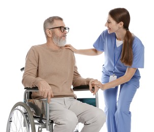 Caregiver assisting senior man in wheelchair on white background. Home health care service