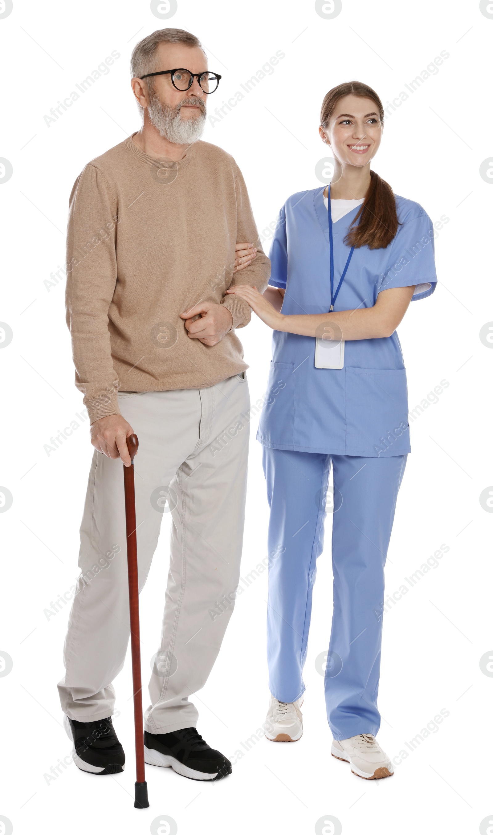 Photo of Caregiver supporting senior man with walking cane on white background. Home health care service